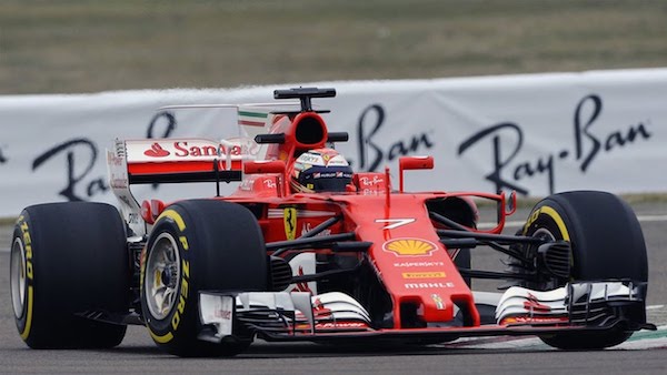 A Formula 1 Ferrari showing the front wing, rear wing, and exposed tires