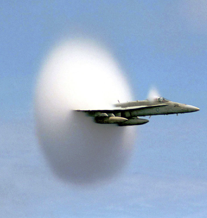 Second photograph of transonic shock wave condensation on a different aircraft