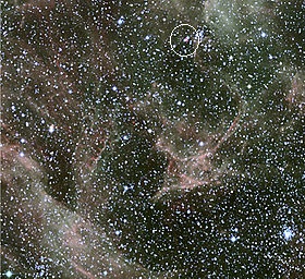 Wide-field image of the Magellanic Cloud with SN 1987A remnant circled in purple